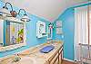 Upstairs master bathroom; double sinks, fun blue beachy color and lots of natural light!