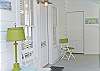 The wrap around screen porch is a great place to relax and enjoy Tybee