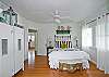 The master bedroom includes the queen bed, master bedroom, sitting area and also acess to screened porch.