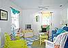Large, open, colorful living area.