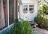 Unique window boxes full of gorgeous seashells! Great idea for a beach cottage!