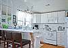 A view into kitchen from dining area.