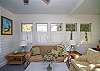 This is the former screened porch that has been fully-enclosed and is now a separate sitting and dining area.