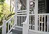 Door and staircase outside from the enclosed porch off of ktichen.