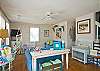 Beach towels at the front door let you know you are on vacation at the beach!
Large, open, bright family room with denim beach-friendly furniture.
