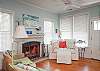 Our living room features a working fireplace and beautiful hardwood floors.