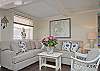 The first floor living room area is a combination of the living room with sofa and cable TV, dining room area with table that seats 6 people.