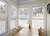 The sun room also has a dining table for eating, game playing or putting together a jigsaw puzzle!