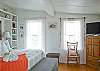 The master bedroom has windows on all sides with great views of the backyard and garden.