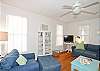 Spacious living room with 2 sofas, large chair &amp; ottoman, flatscreen TV and art from local artists! Loads of fun beach decor!