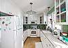 The cool clean kitchen is completely equipped and just the right size to have a helper and whip up fat juicy burgers for the grill out back.