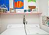 Big, bright laundry room with storage for games for all ages!