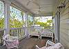 The sleeping porch is off the master bedroom on the 2nd floor. The porch is screened in and surrounded by large live oaks.