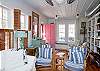 Living room.  Love that pink door!