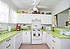 This fully stocked and completely renovated kitchen has everything you need. And where else but Tybee can you cook in a lime green kitchen! Pass through to living area.