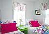 Bedroom #1 - 2 twin beds. Note the fun, cheerful, beachy colors and decor!