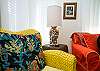 Close-up view of the colorful living room with loads of details perfect for Paula's beach house!
