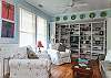 The cottage has a very open layout. This is the large family room with cable TV and library, dining room and even the kitchen. There is also a wood burning fireplace. Tall ceilings and lots of natural lighting.