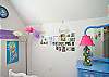 Upstairs bedroom #1:  features a double bed and fun wall art; lavender and blue color scheme!