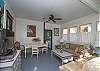 This is the former screened porch that has been fully-enclosed and is now a separate sitting and dining area.