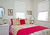 Master bedroom with private bath features a queen bed.