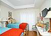 Third bedroom has two twin beds and lots of fun, beachy details! Flatscreen TV!