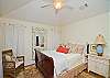 This beautiful and luxurious master bedroom and bath is upstairs. Lots of soft fluffy pillows are on the queen-size sleigh bed that is made up with high-thread count 100% cotton bedding. All furnishings are from the new Paula Deen Furniture collection.