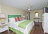 This is the other bedroom on the first floor. This bedroom has a king bed with cable TV.  The headboard is an old vintage shutter painted a GREAT green!