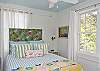 This bedroom is also upstairs and features vintage "bark cloth" fabric for the headboard.