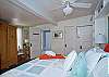 Anopther view of master bedroom and entrance to master bathroom.
