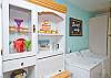This wonderfully large living area also includes this dining and laundry area.  Notice all the fun details in the cabinet!