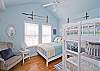The bedroom includes one double and one set of bunk beds. Sleeps 4 people.