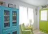 Views of the spacious, open living and dining area. Bright, colorful and fun! This area includes a bar with extra seating; fun place to sit and have a snack!