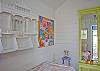 The back cottage is a little haven. Great for lounging or kids that want to "glamp" (glamour camp!) Two twin beds, AC, bright and cheerful local art and unique cottage decor.