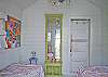 The back cottage is a little haven. Great for lounging or kids that want to "glamp" (glamour camp!) Two twin beds, AC, bright and cheerful local art and unique cottage decor.