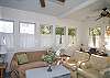 This is the former screened porch that has been fully-enclosed and is now a separate sitting and dining area.