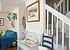 Large, open, bright family room with denim beach-friendly furniture &amp; flatscreen TV.