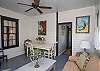 This is the former screened porch that has been fully-enclosed and is now a separate sitting and dining area.
