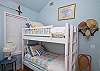 The bedroom includes one double and one set of bunk beds. Sleeps 4 people.