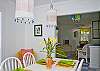 Dining area with view into living area.