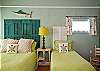 Master bedroom. This bedroom offers a queen bed and a twin bed and a full master bathroom.