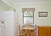 The kitchen has a seating for 4 people. Two kitchen counter seats and these two seats at the kitchen nook in the kitchen.