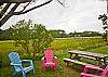 The back yard overlooks the salt marsh.  Chairs and a picnic table allow you to enjoy the views, watch for birds and enjoy.  The back yard is fully fenced.