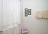 The cottage features two full bathrooms. They each have a shower.