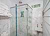 Second bathroom with glass shower; clean, white &amp; bright!