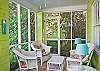 Screened porch is on front of cottage &amp; faces Jones Ave. Front yard is surrounded by an adorable picket fence! Great place for enjoying Mermaid Morning Bliss coffee!