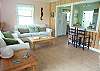 Our living room has a sofa, love seat, Cable TV, and wonderful photography from the owners!  Great space!