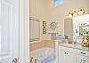 Master bathroom. For the perfect relaxing bath, slide into this jetted-tub. This bath is complete with a large shower stall, vanity and separate water closet.