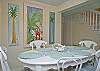 The first floor living room area is a combination of the living room with sofa and cable TV, dining room area with table that seats 6 people.