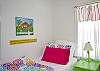 Bedroom #1 - 2 twin beds. Note the fun, cheerful, beachy colors and decor!
